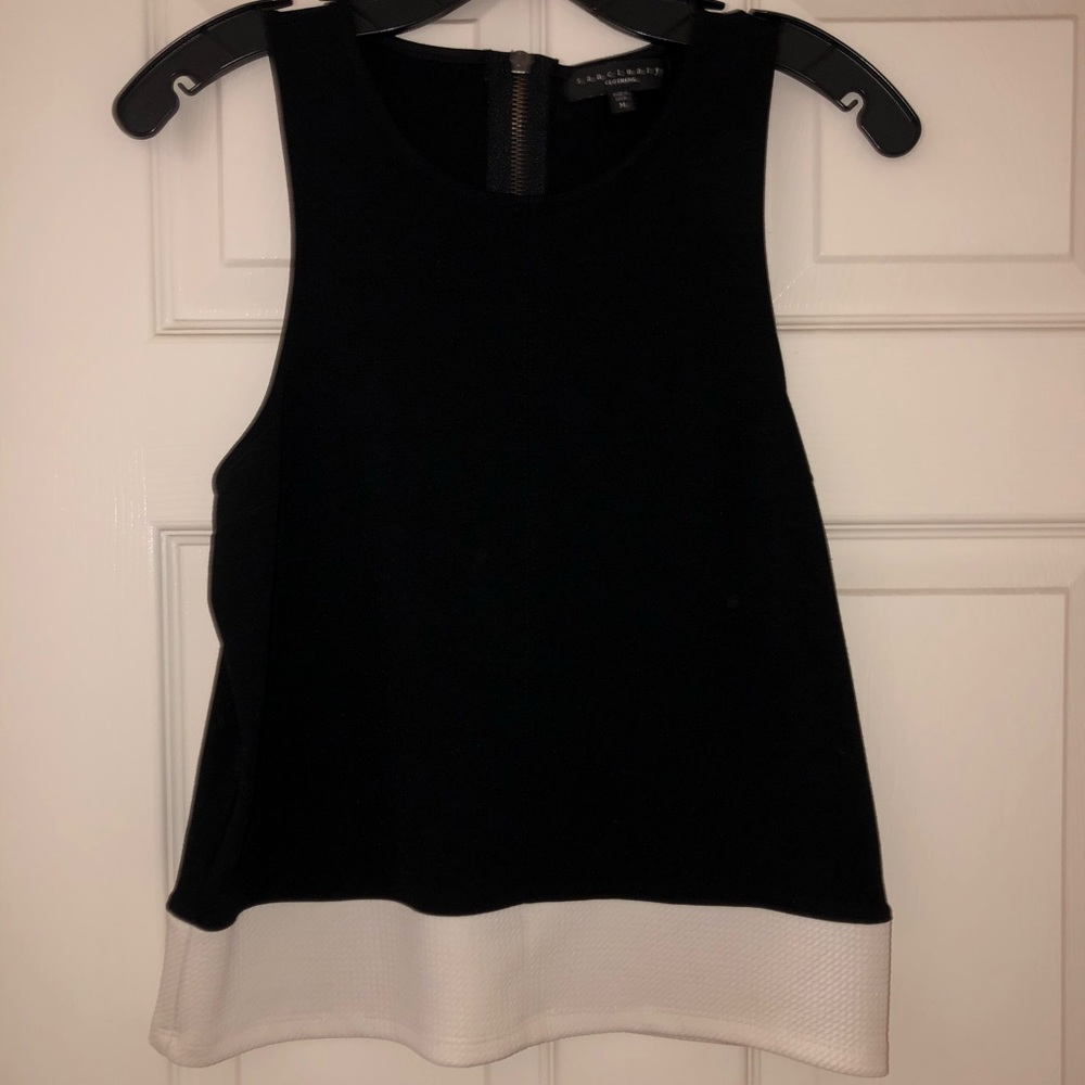 Sanctuary top - black with white at the bottom.